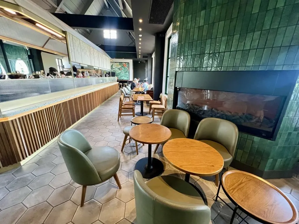 Green-tile wall and fireplace inside Starbucks Promisedland Resort — Taiwan Insider